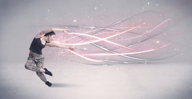 A pretty hip hop dancer dancing contemporary dance illustrated with glowing motion lines in the background concept.